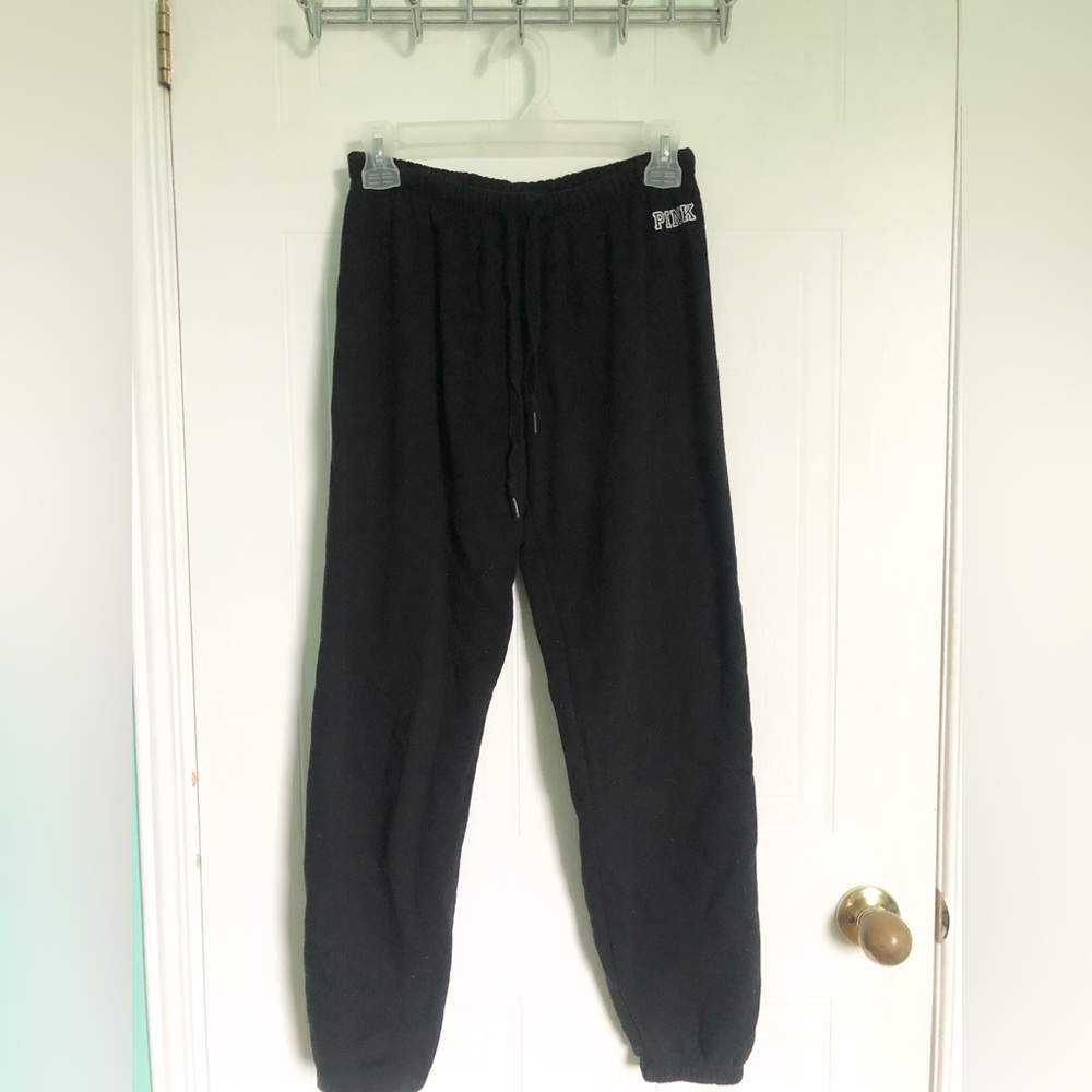 Joggers with pink logo on the top corner